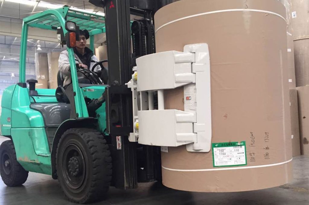 Customer using paper roll clamp forklift