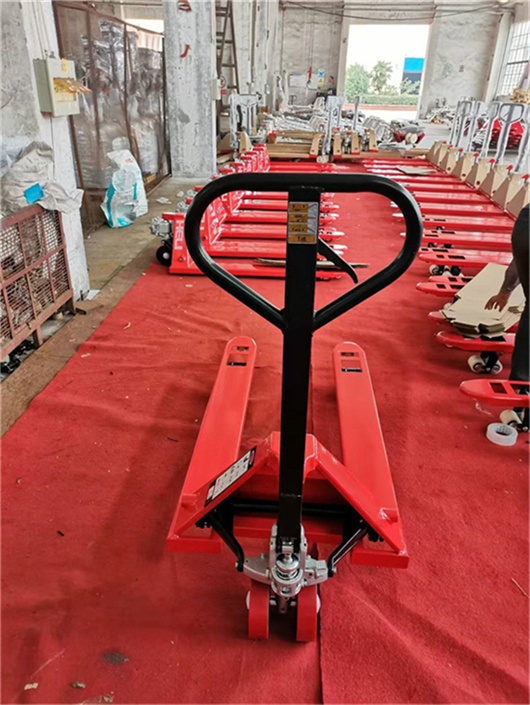 Red manual hydraulic truck